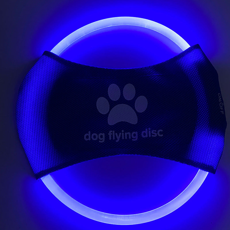 A dog catching a red glowing LED frisbee with other color options shown in separate images. The frisbee is rechargeable and appears to be made of a soft, durable material.
